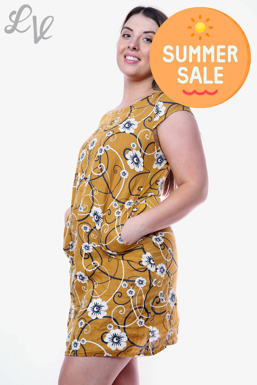 Damesjurk met bloemen- en krulprint Mosterdstukprijs WAS € 14,99 NU € 8,99