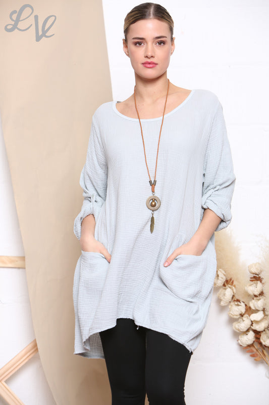 Dames effen tuniektop met zakken en zilverkleurige ketting