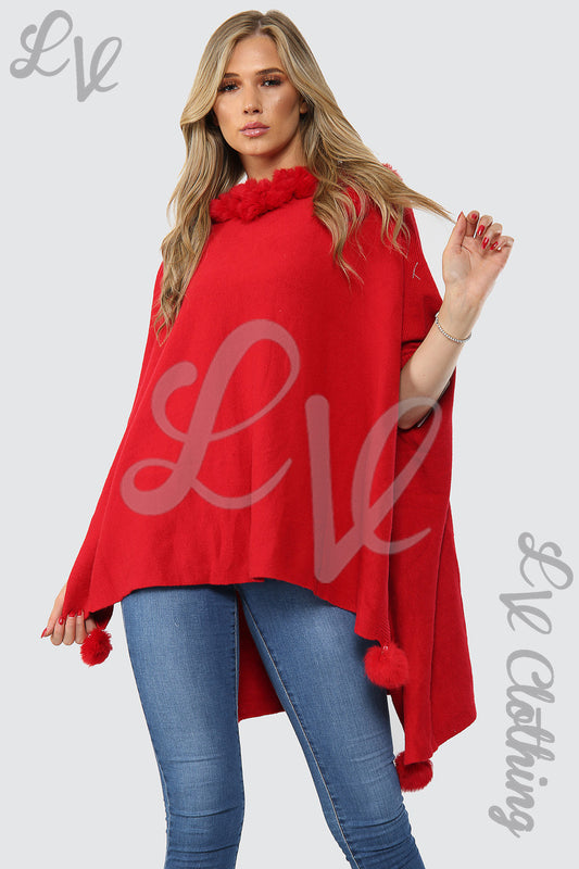 Red fur-neck poncho with pom-pom trim, asymmetric hem, and relaxed fit