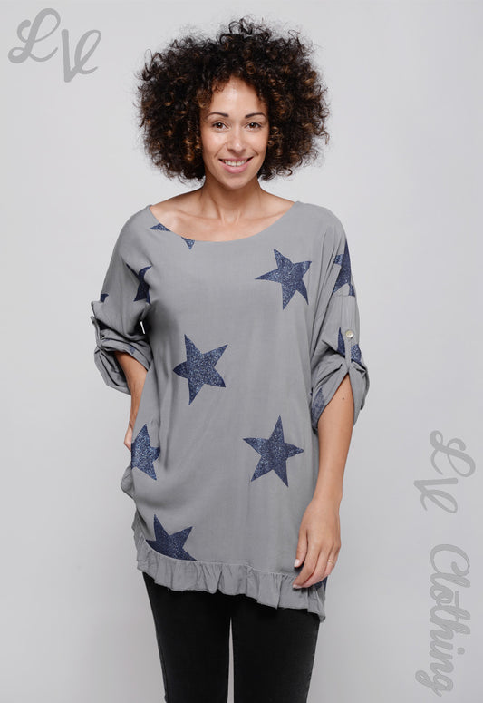 Star print layered top in light gray with navy stars, ruffled hem, wide sleeves