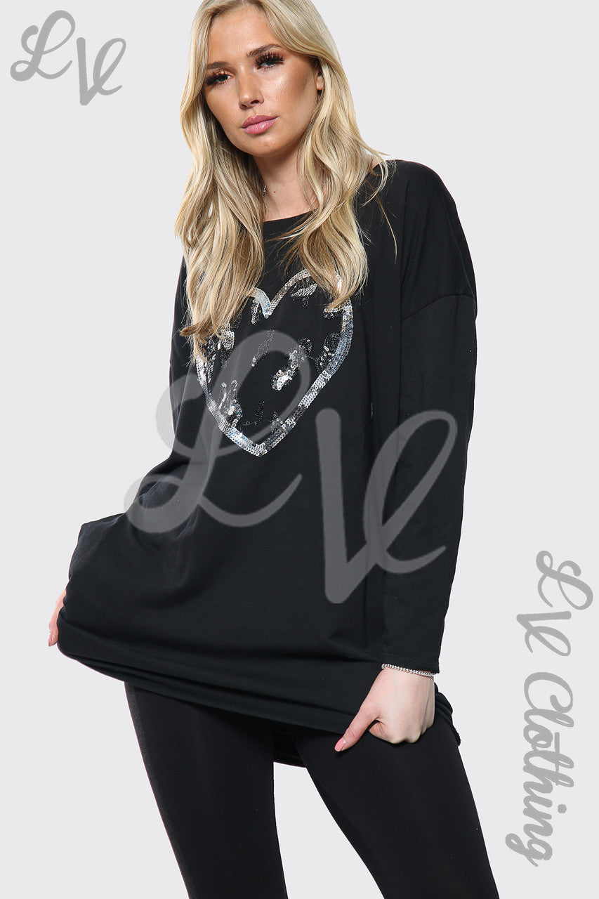 Dames oversized top met lovertjeshartprint zwart stukprijs € 15,99