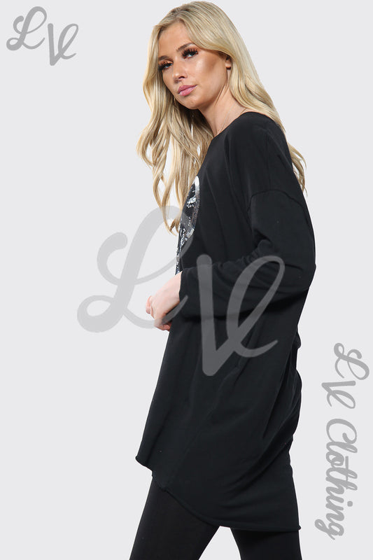 Black oversized long-sleeve top with sequin heart print, side view