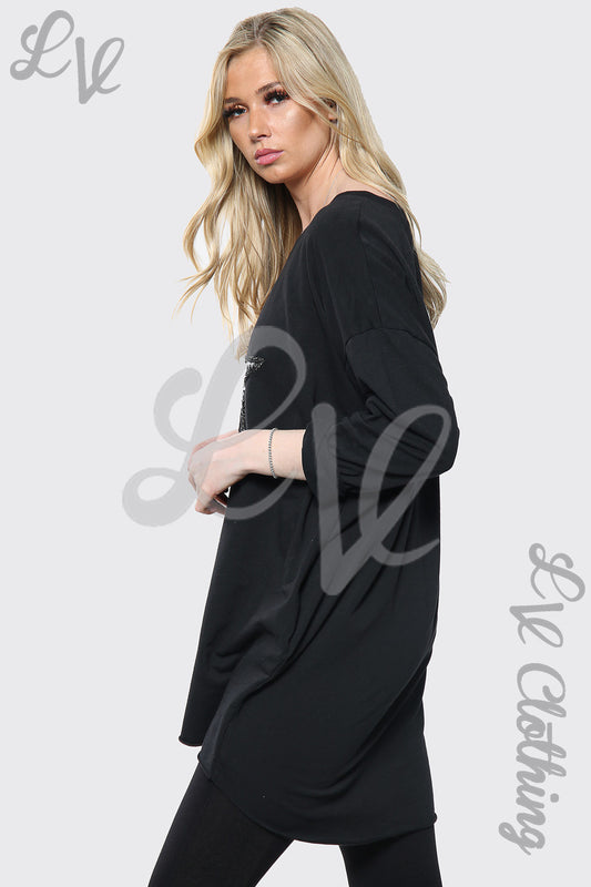 Black oversize top with silver sequin star print, long sleeves, relaxed fit