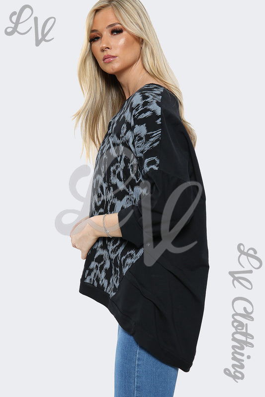 Black oversized sweatshirt top with grey abstract paint print, side view, long sleeves