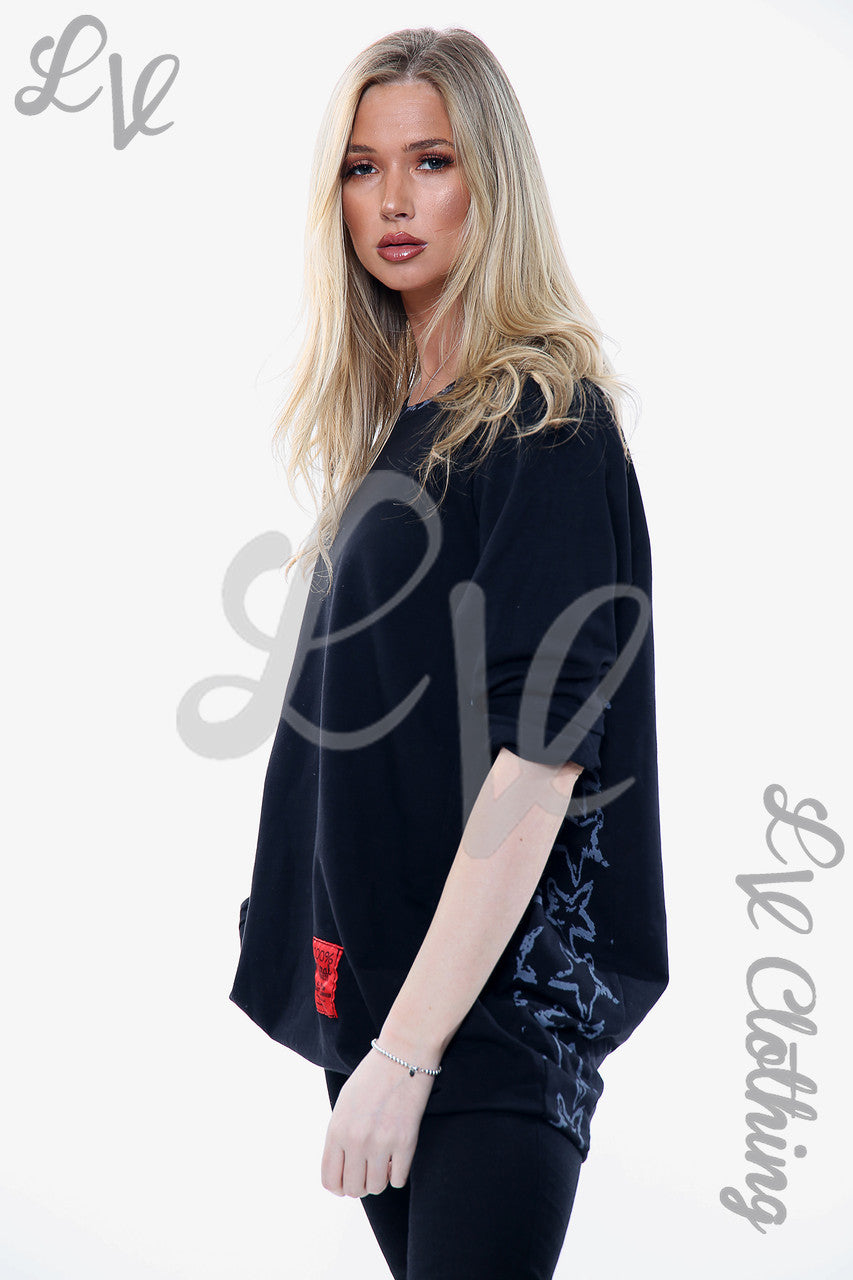 Ladies Star Print Neck & Hemline Top Black Unit Price £15.99