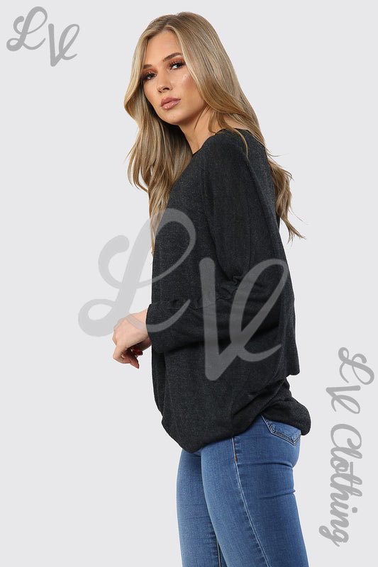 Women’s black fine-knit tunic top with crew neck and long sleeves, hi-lo hem