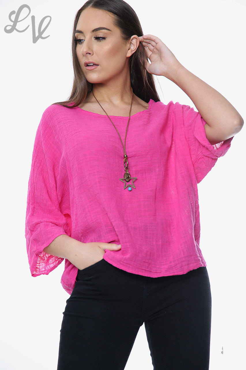 Bubblegum pink women’s plain tunic top with wide round neckline and rolled three-quarter sleeves