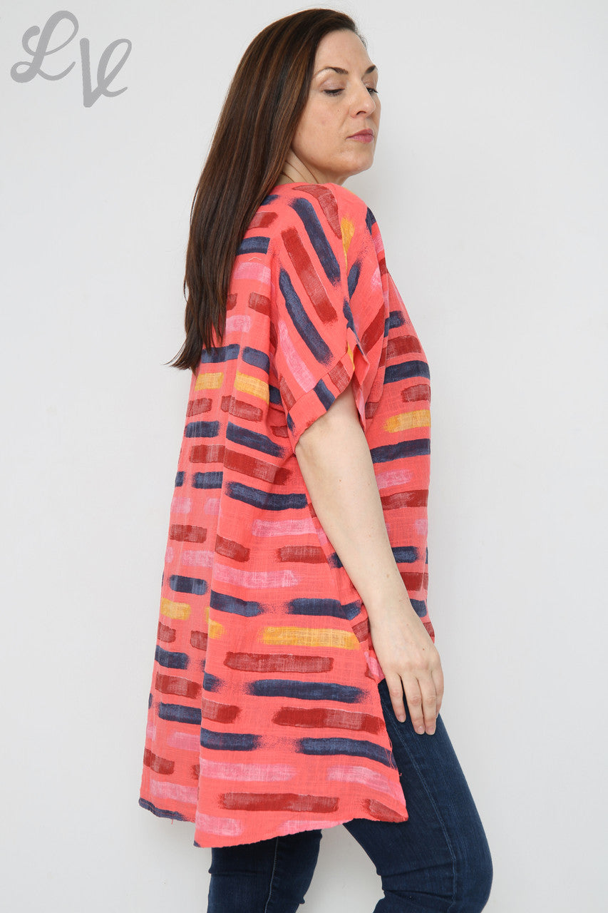 Dames top met asymmetrische streepjesprint Koraal Prijs per eenheid €8,99