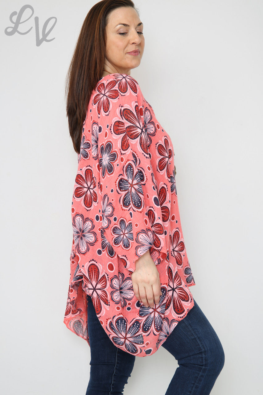 Dames top met vleermuismouwen en bloemenprint koraal