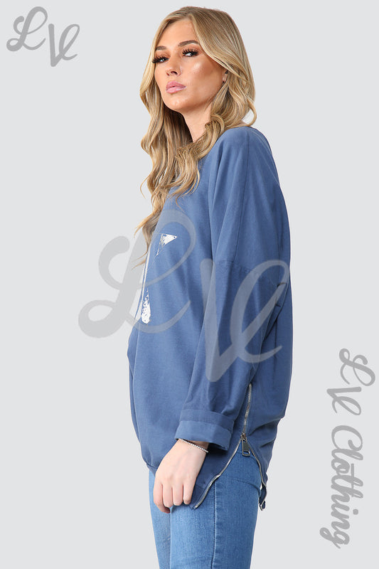 Blue sweatshirt tunic top with foil star graphic, long sleeves and crew neck