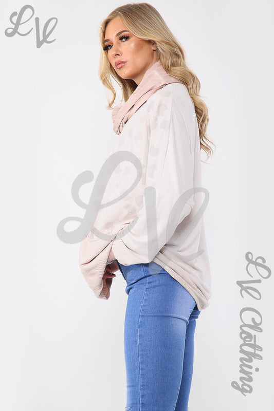 Dusty pink oversized top with circle print and draped matching scarf, side view
