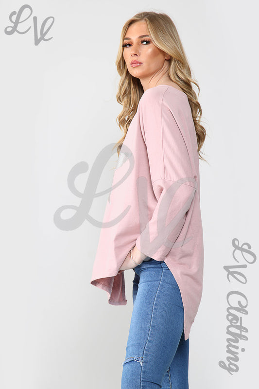 Dusty pink oversized tunic top with silver foil star, long sleeves, side view