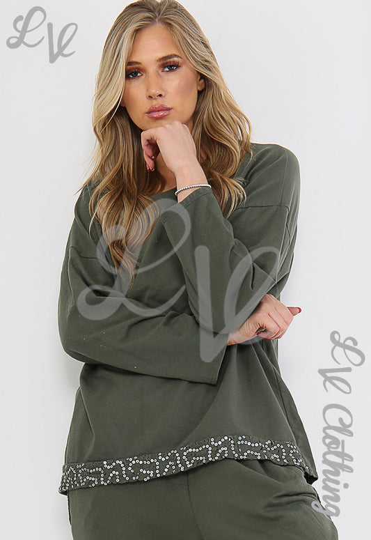Ladies sequin-trim sweatshirt top in dark green, with sparkling hem band