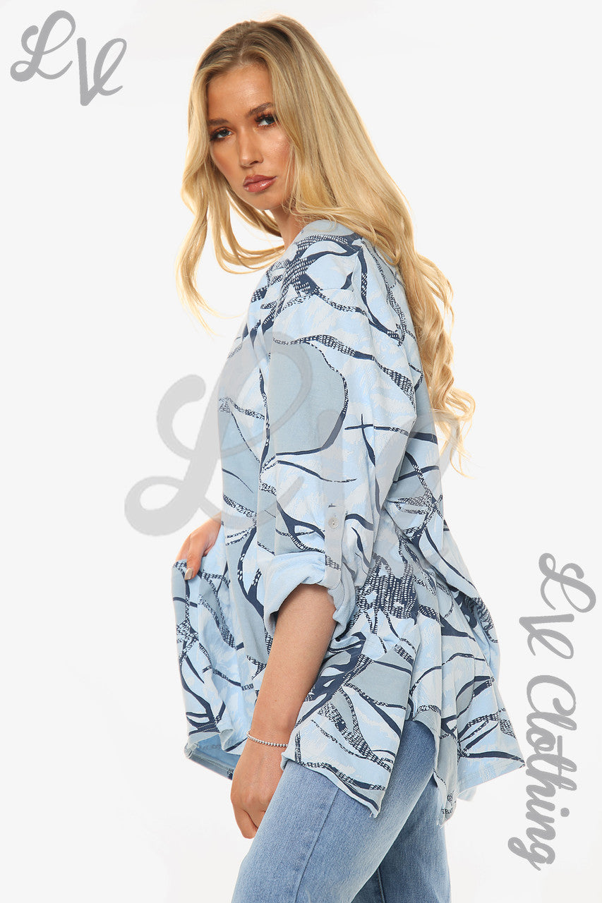 Dames top met abstracte print lichtblauw per stuk € 11,99