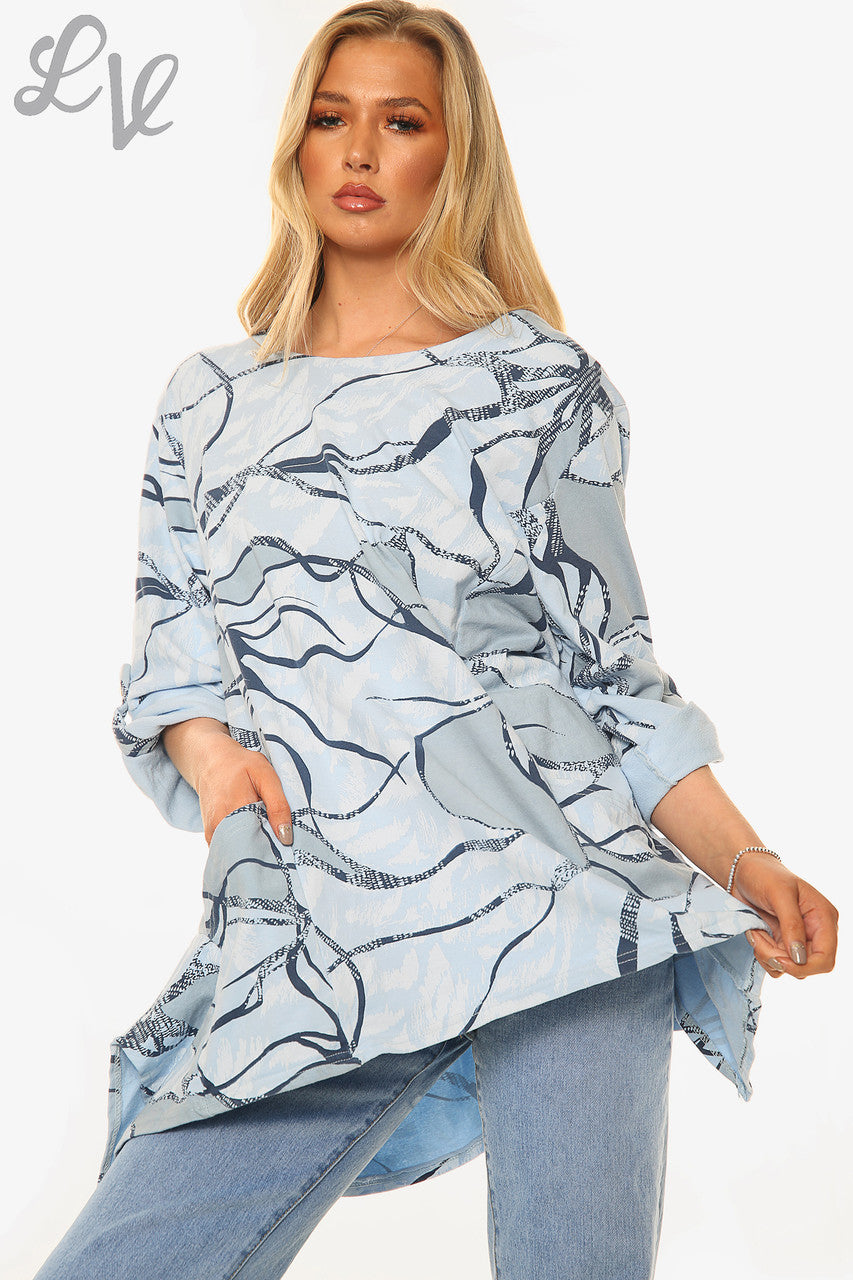 Dames top met abstracte print lichtblauw per stuk € 11,99