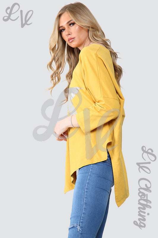 Mustard oversized tunic top with silver star foil print, 3/4 sleeves, curved hem