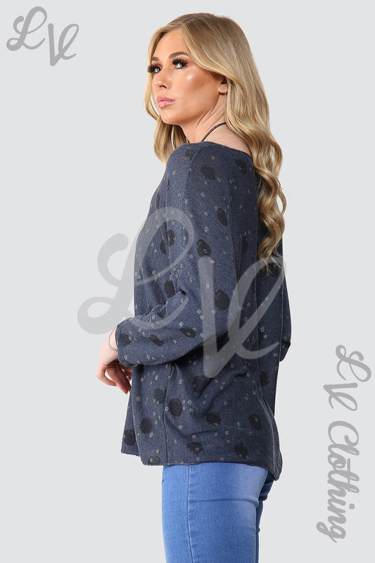 Navy spotty long-sleeve top with round neckline