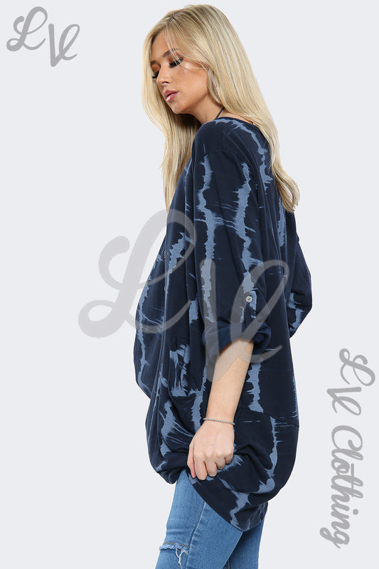 Navy tie-dye oversized hi-lo necklace top with long sleeves and draped hem