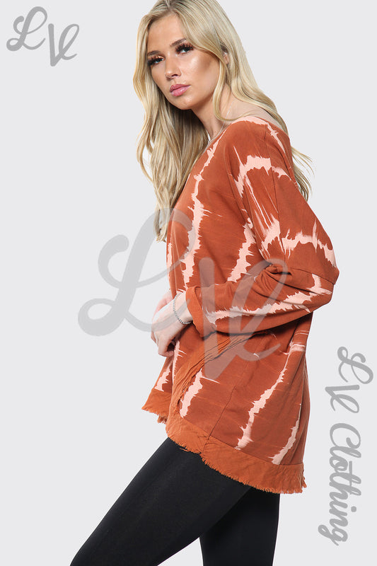 Rust tie-dye V-neck oversized top with long sleeves, white streak pattern