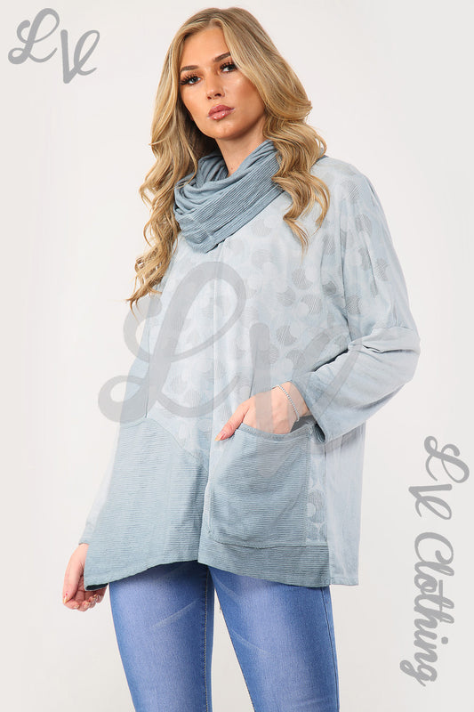 Oversized light blue top with circle print and draped scarf, long sleeves