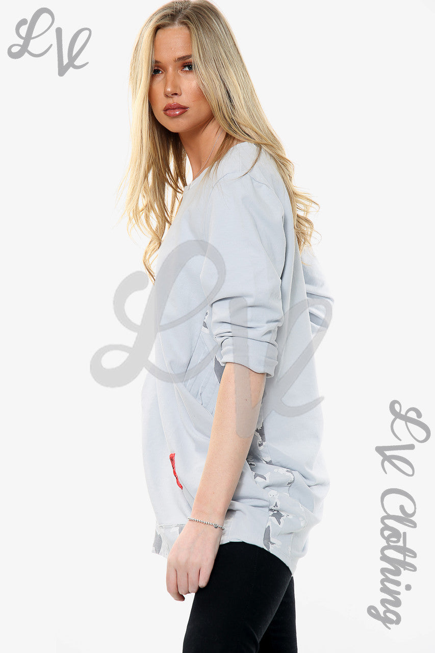 Dames top met sterrenprint, hals- en zoomlijn, zilverstukprijs €15,99