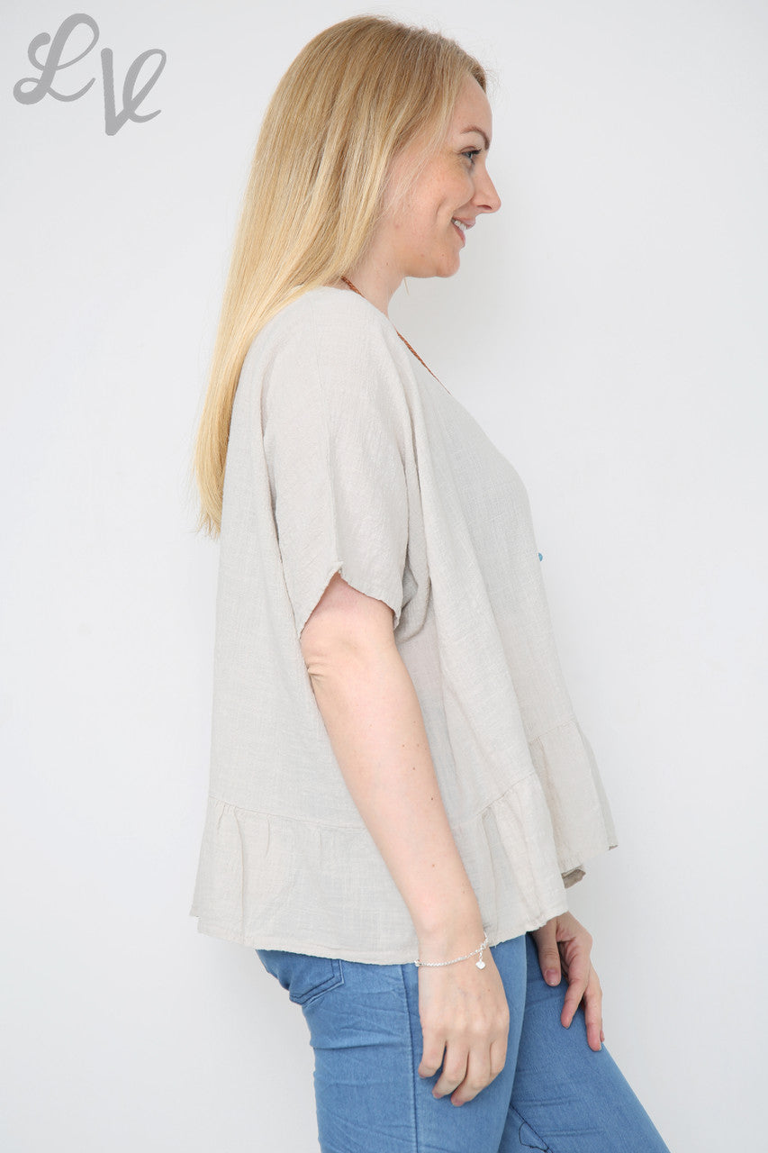 Dames top met ruches en kettingsteentje