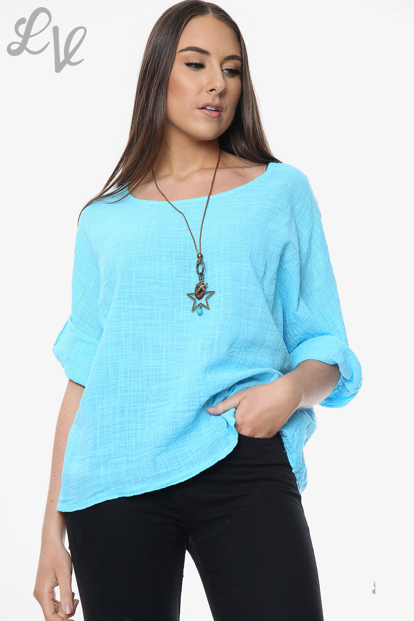 Sky blue women’s plain tunic top with wide round neckline and rolled three-quarter sleeves