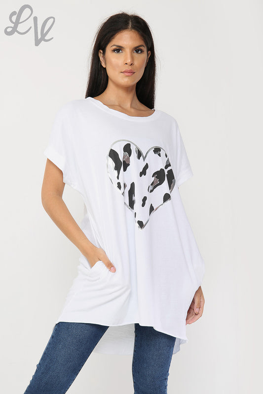 White tunic top with short sleeves and foil heart graphic front