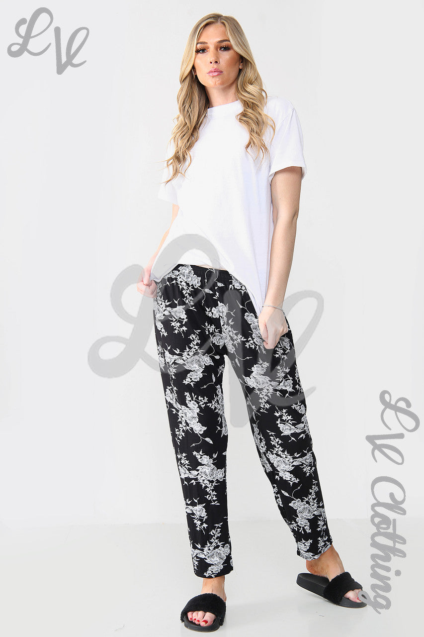 Damesbroek met bloemen en bladprint Zwart