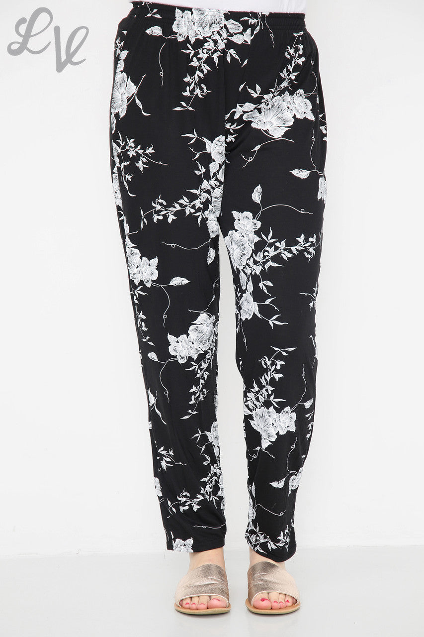 Damesbroek met bloemen en bladprint Zwart