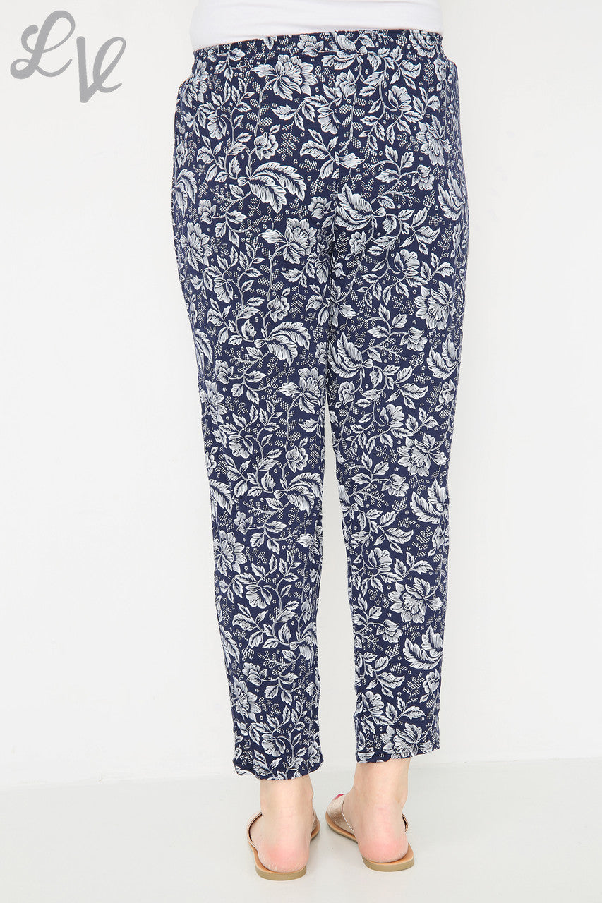 Navy leaf-outline print trousers, ankle length, elastic waist