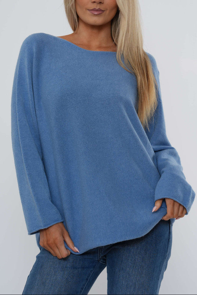 Denim blue boat neck knit sweater with long sleeves and relaxed curved hem