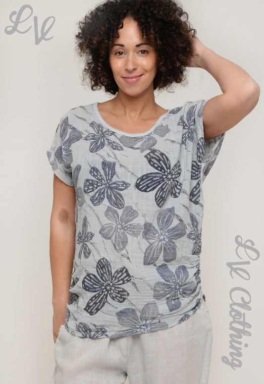 Floral short-sleeve top with butterfly print on light blue base