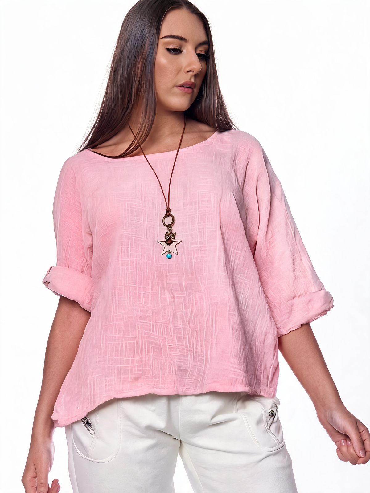 Soft pink quarter-sleeve plain top with relaxed fit and textured fabric finish.