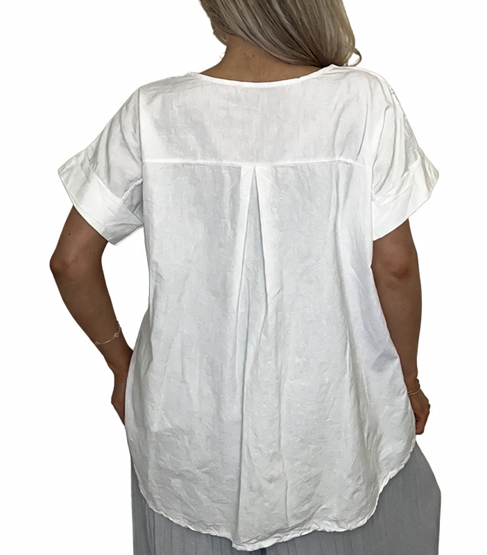 Eyelet embroidered tunic top back in white with short sleeves and center pleat