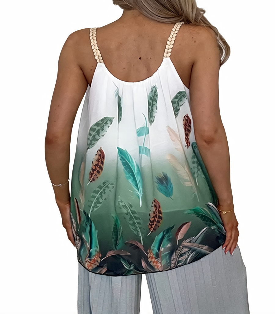 Back view of tropical feather print halter top with open back and white/teal-green feathers