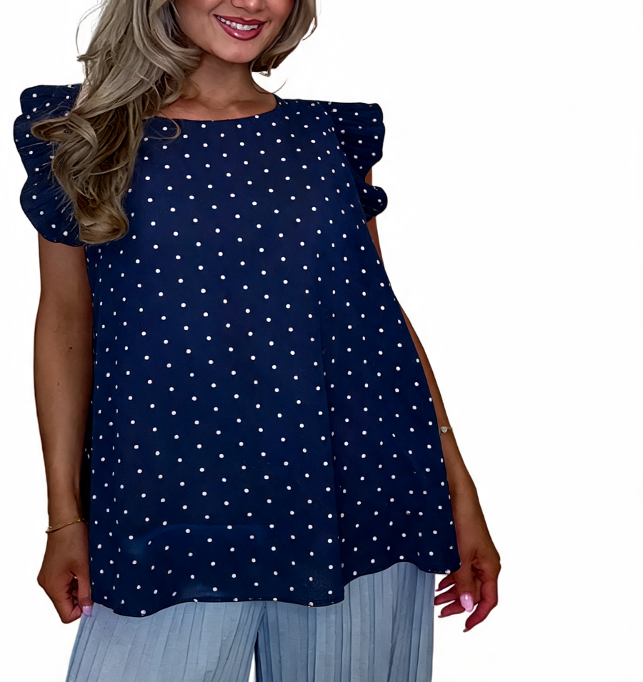 Navy polka dot swing top with ruffle sleeves and straight hem