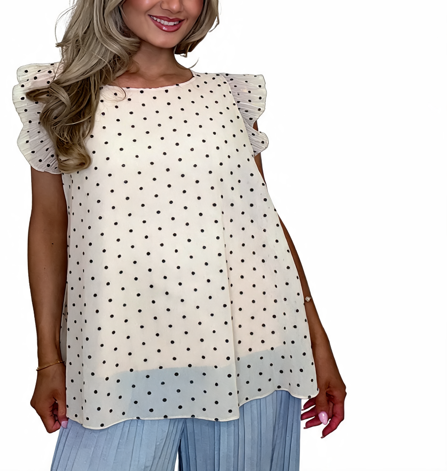 White polka dot swing top with ruffle sleeves and softly flared body