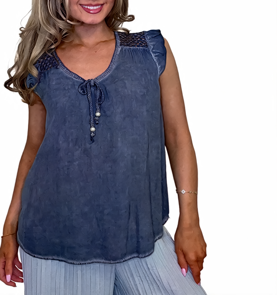 Mineral-wash tie-front sleeveless blouse in denim blue with crochet yoke and bead tie