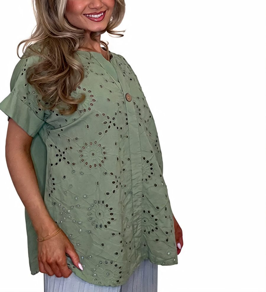 Eyelet embroidered tunic top in sage green with short sleeves and button front, relaxed fit