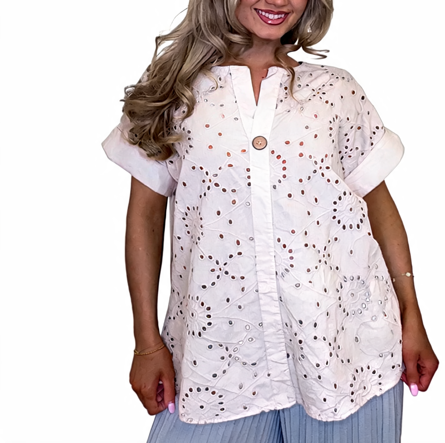Eyelet embroidered tunic top in white with short sleeves and button front, relaxed fit
