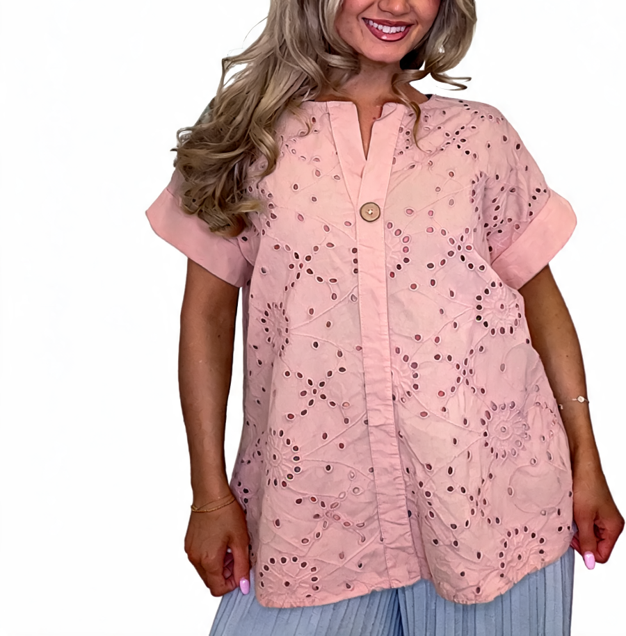 Eyelet embroidered tunic top in pink with short sleeves and button front, relaxed fit