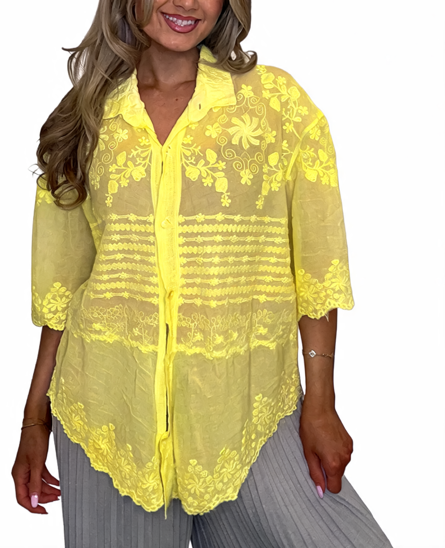 Yellow sheer embroidered lace button-up top with pointed collar, front buttons, scalloped hem