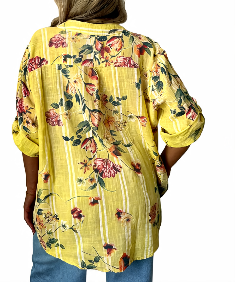 Floral button-up tunic top, yellow floral print, back view with full-length motif