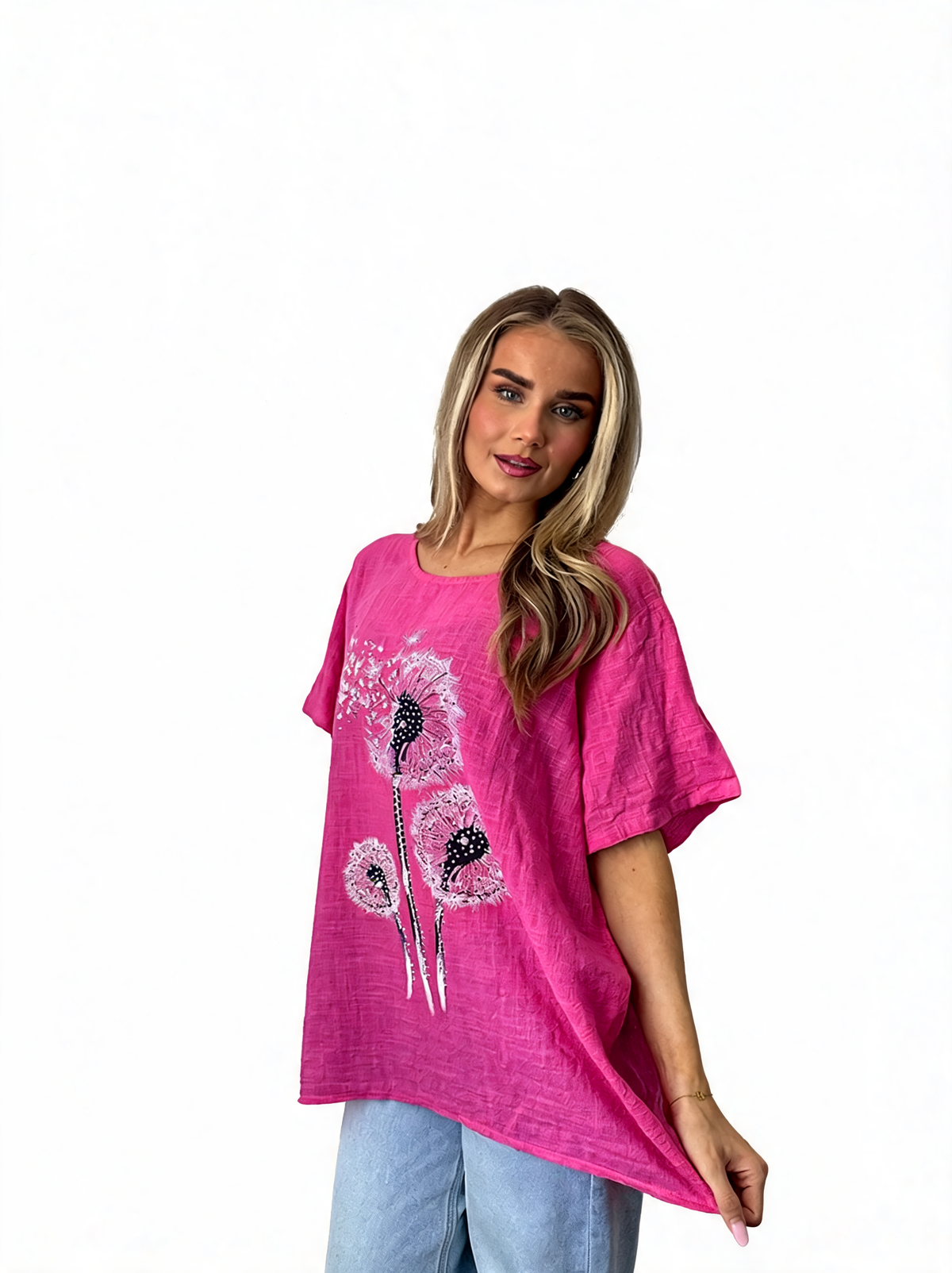 Women’s cerise dandelion flower print tunic top, angled front view