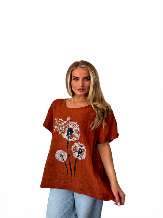 Women's rust dandelion flower print top, short sleeves and round neckline