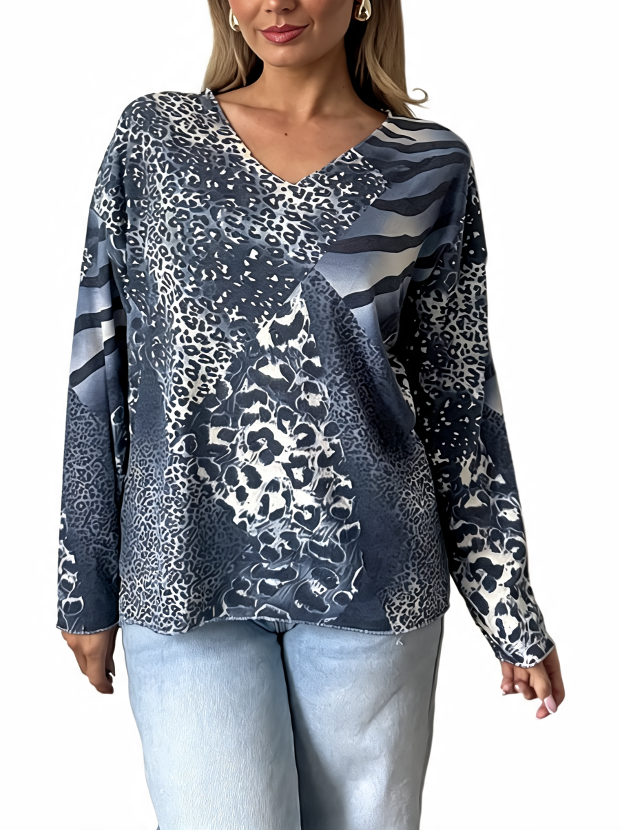 Navy and white mixed animal print V-neck long sleeve top with asymmetrical wrap