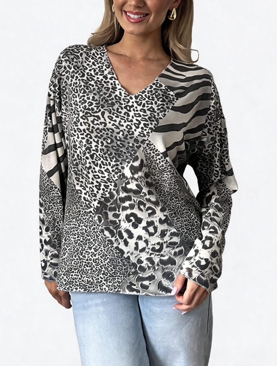 Black and white mixed animal print V-neck long sleeve top with zebra stripe overlay