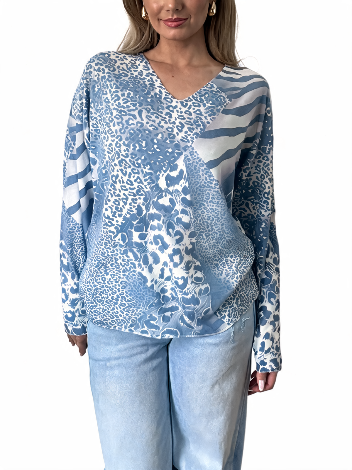 Light blue and white mixed animal print V-neck long sleeve top with zebra stripe panel