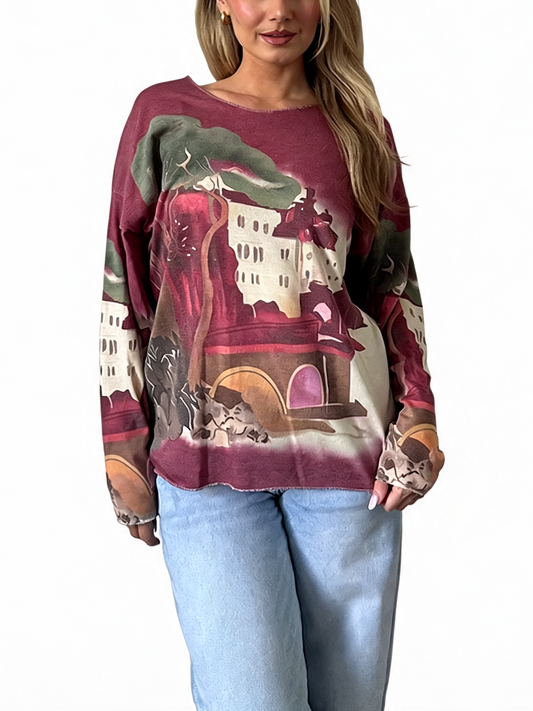 Long-sleeve pullover top in burgundy with vintage landscape graphic print.